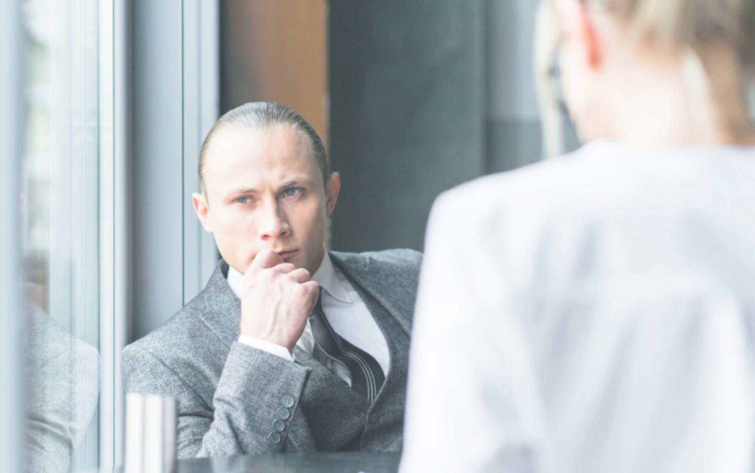 Financial planning meeting with calculator and budget sheets