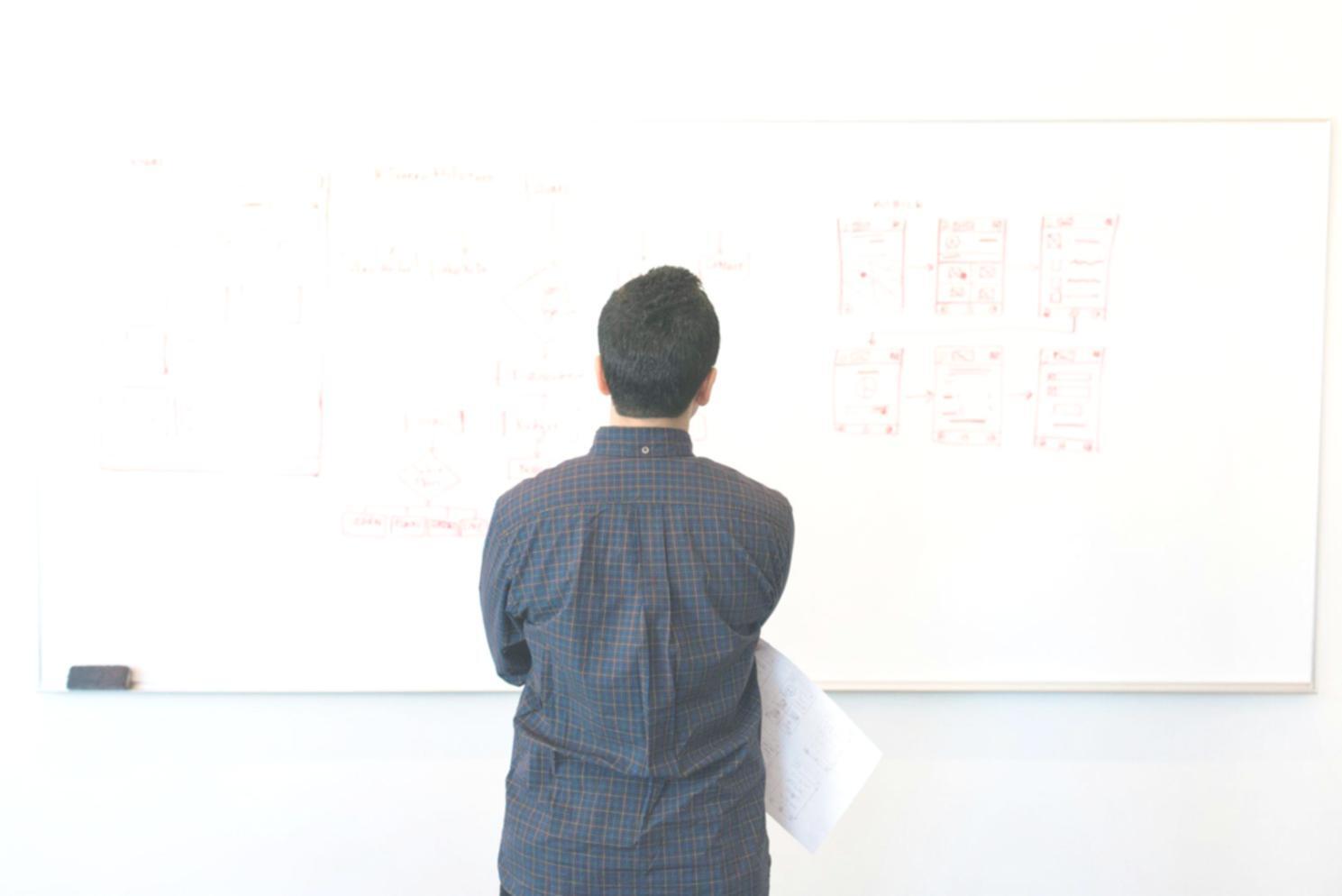 Person reviewing financial documents at a well-organized workspace